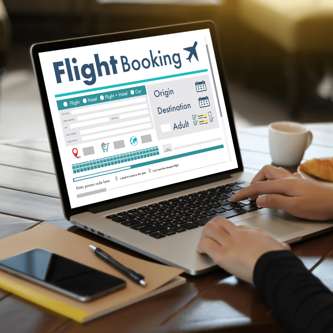 Flight booking on a laptop, displaying flight options and travel details 