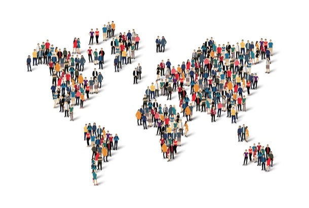 A diverse group of individuals arranged to form a large world map, symbolizing unity and global connection.