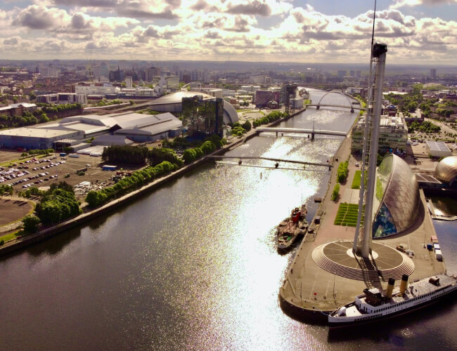 An aerial view of the city of Glasgow with the river running through it